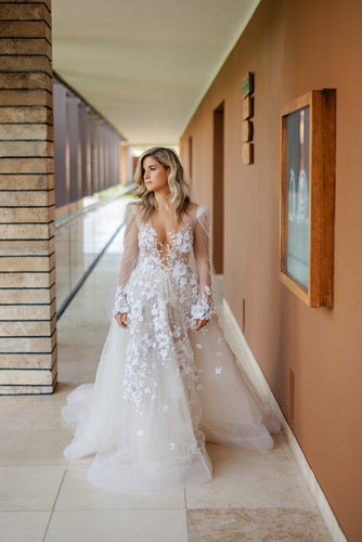 C2024-LS75V - Sheer long sleeve wedding gown with deep v-neck and a-line style skirt