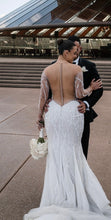 C2024-LS708 - Sheer illusion crystal beaded wedding gown with long sleeve and button up back