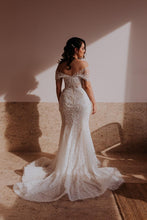 C2021-aSL0887 Vestido de novia transparente de encaje con hombros descubiertos y cola