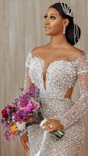 C2022-BB28 - Robe de mariée transparente à manches longues et perles de cristal et de perles